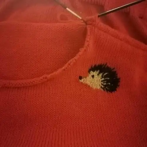 图案女士棒针套头毛衣袖子:10号针起60针单罗文织26行换9号针织平针