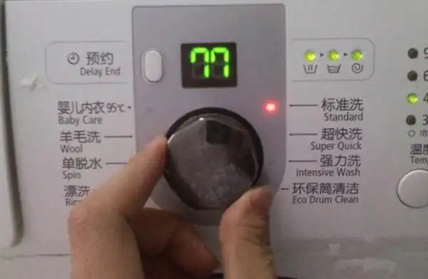 海尔滚筒洗衣机说明书放入洗衣粉或洗衣液4打开洗衣