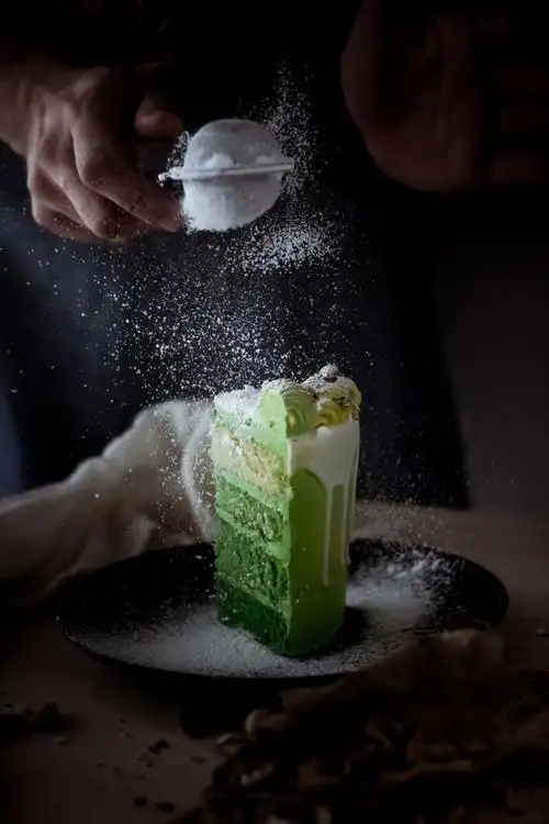 green pistachio cake and white chocolate drip