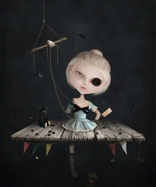 木桌上的卡通小女孩木偶