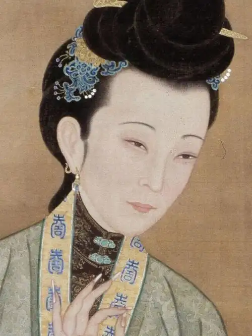 雍正心中的美人十二美人图之烛下缝衣